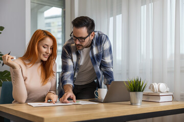 Team Collaboration in Modern Office Space Among Professionals