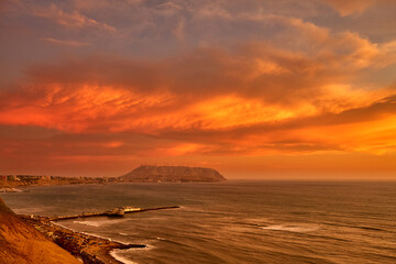 Miraflores, a district located in Lima, Peru, offers breathtaking sunset views along its coastline facing the Pacific Ocean