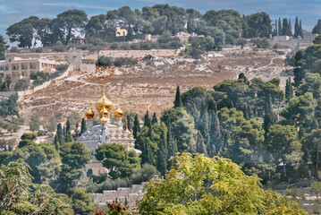 Fototapeta premium The church of Saint Mary Magdalene is situated on the slope of the Mount of Olives in the Garden of Gethsemane, in Muscovite style with golden onion domes or cupolas. Jerusalem, Israel, 2016
