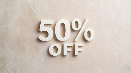 A promotional sign indicating a 50 percent discount is prominently featured on a textured beige wall, aimed at attracting shopper attention in a retail setting.