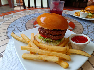 double patty hamburger and fries