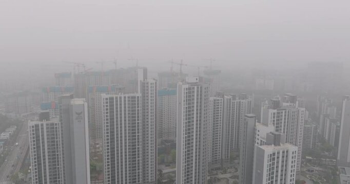 Aerial View of a Large Apartment Complex in Heavy Smog