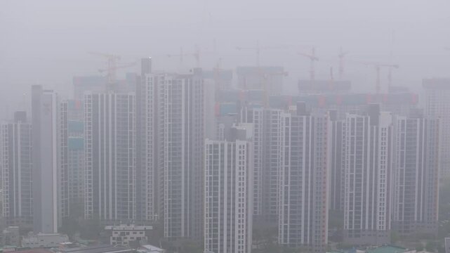 Aerial View of a Large Apartment Complex in Heavy Smog
