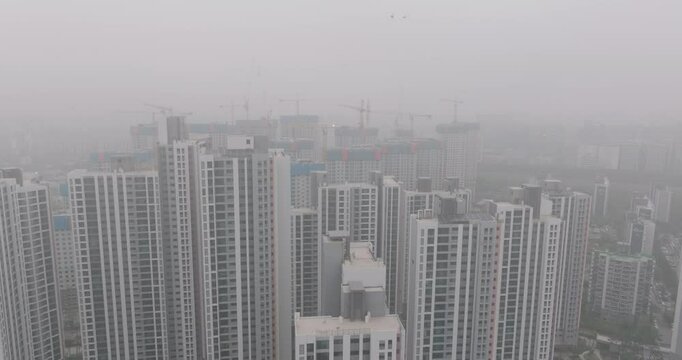 Aerial View of a Large Apartment Complex in Heavy Smog