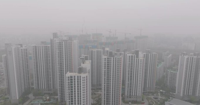 Aerial View of a Large Apartment Complex in Heavy Smog