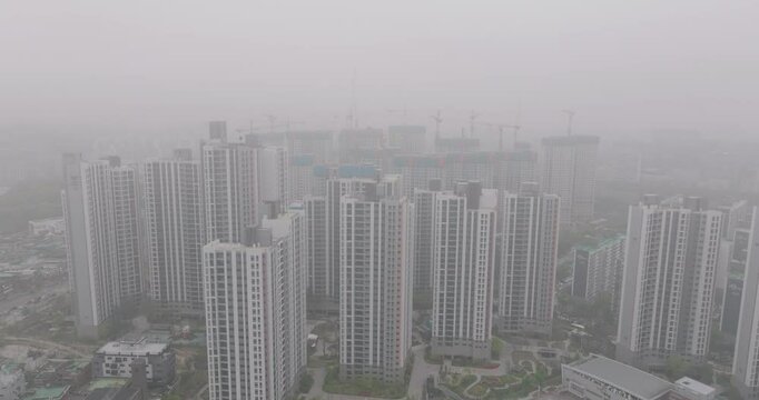Aerial View of a Large Apartment Complex in Heavy Smog