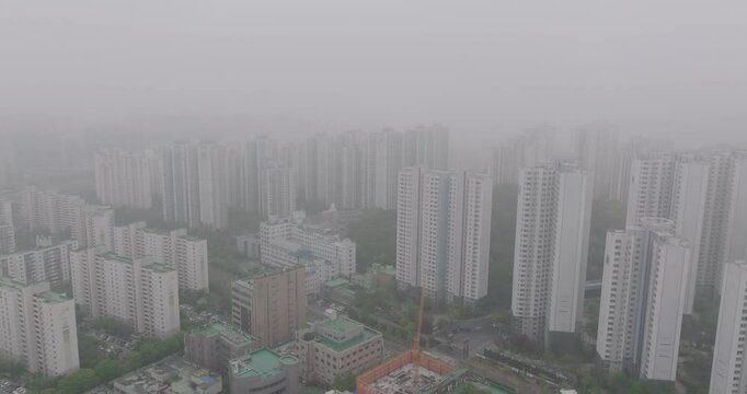 Aerial View of a Large Apartment Complex in Heavy Smog