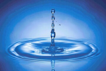 A blue water droplet is falling into a large body of water