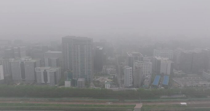 Aerial View of a Large Apartment Complex in Heavy Smog