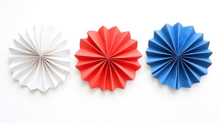 Red, white, and blue paper rosettes with 4th of July theme isolated on white background