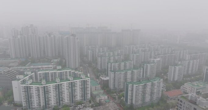 Aerial View of a Large Apartment Complex in Heavy Smog