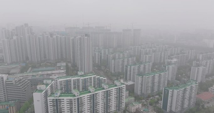 Aerial View of a Large Apartment Complex in Heavy Smog