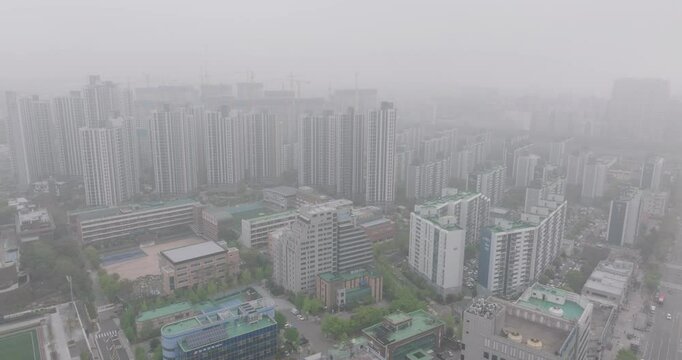 Aerial View of a Large Apartment Complex in Heavy Smog