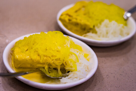 Kesar kulfi with falooda served on plate. This traditional ice cream or frozen dessert is found in India made of milk and saffron.