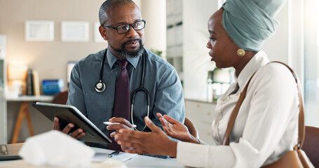 Tablet, consultation and black woman with doctor in hospital for medical diagnosis or wellness advice. Discussion, digital technology and female patient with healthcare worker for checkup in clinic.