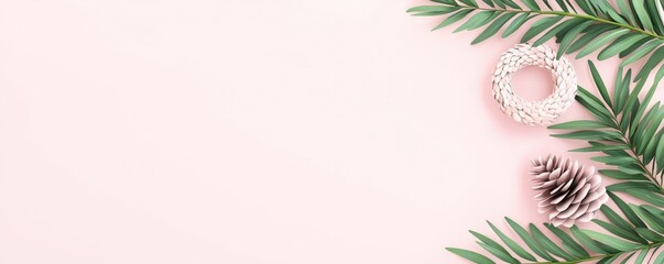 Obraz premium Elegant minimalist composition of green palm leaves with natural elements on soft pink background for modern decor inspiration