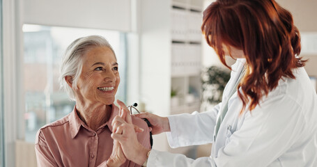 Senior, woman and holding hands with doctor in consultation for medical results, support and...