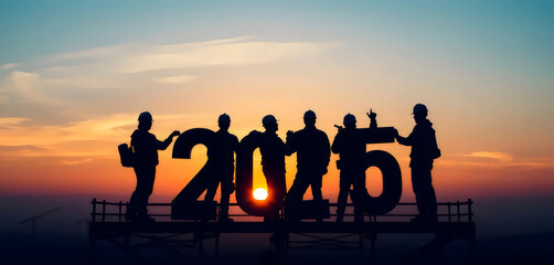 Obraz premium Silhouettes of Workers Holding 2015 at Sunset