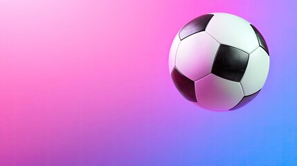 Fototapeta premium Dynamic soccer ball on a vibrant pink and blue gradient background.