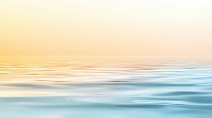 Obraz premium A serene seascape featuring gentle waves and a soft gradient of colors from orange to blue, evoking a calm and tranquil atmosphere.