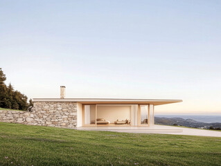 Modern hillside retreat with glass walls and stone accents overlooking a serene landscape