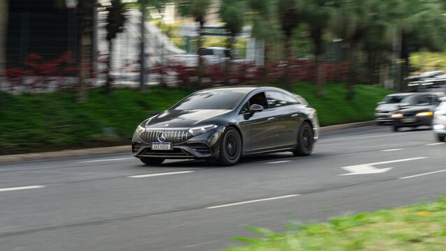 Black Mercedes Benz EQS 53 AMG in city traffic, Luxury electric car in movement