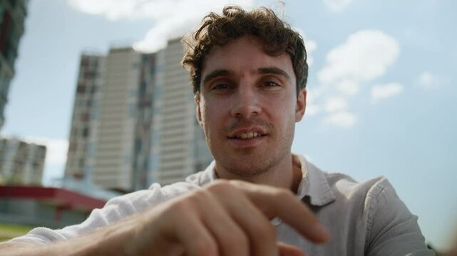 Caucasian man male guy city looking at camera screen display touchscreen view scrolling swipe front interface tapping gesture futuristic cyberspace AR tech hand touching sliding businessman business