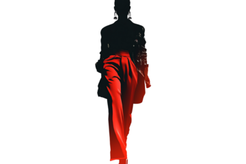 A silhouette of a person in formal attire, walking with confidence, showcasing a striking red skirt that flows elegantly.