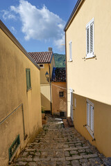 A small street among the old houses of a San Severino Lucano, small town in Basilicata, Italy.
