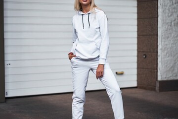 Fashionable woman in white athletic wear