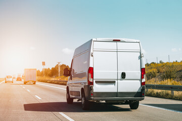 Highway with a white cargo van ahead