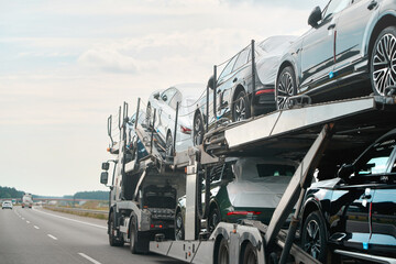 SUVs loaded on hauler truck for delivery