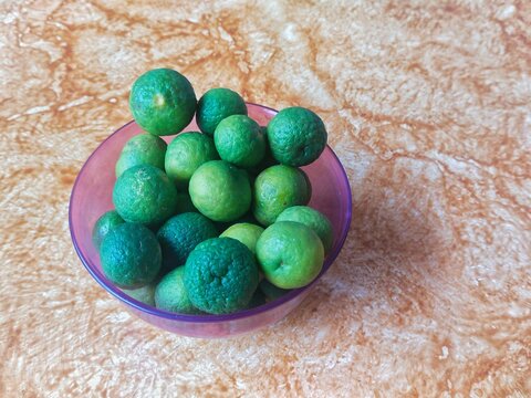 Citrus hystrix known as Jeruk purut or jeruk limau in Indonesia, in a plastic container
