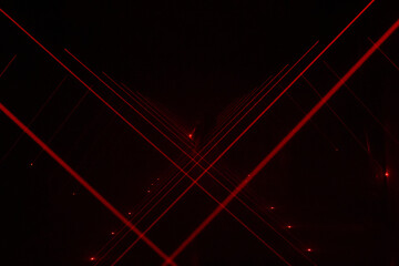 Red lasers in a dark room.
