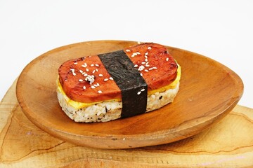 Classic Hawaiian spam musubi, made with grilled spam, seasoned rice, and wrapped with nori seaweed....