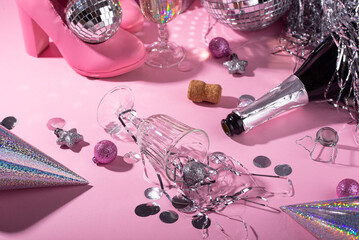 Glamorous party essentials on pink backdrop