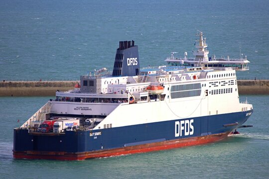 DFDS ferries sailing near Dover with a clear blue sky and calm sea