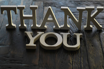 Thank You Message in 3D Wooden Letters on Dark Wood Background - Expressing Gratitude