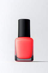 Obraz premium Coral pink nail polish bottle, isolated on white background