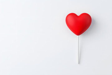 Fototapeta premium Heart-shaped lollipop, isolated on white background