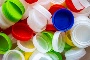 Plastic pet bottle caps. Plastic waste and recycling.