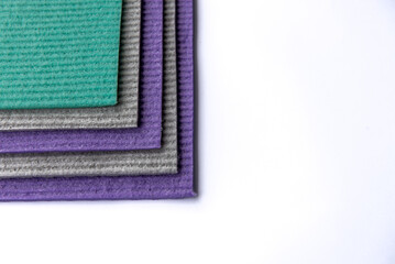 Colourful sponges with visible pores for scrubbing and cleaning.