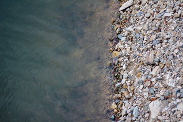 river stones, rocks on the edge of the river