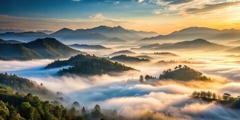 Fototapeta premium Misty morning fog rising from the valley of a mountain range, atmospheric conditions, scenery, fog