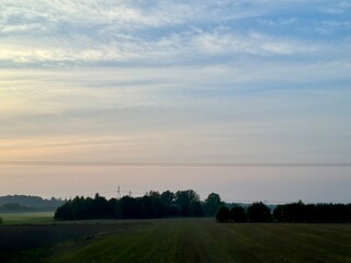Naklejka premium sunrise over the field