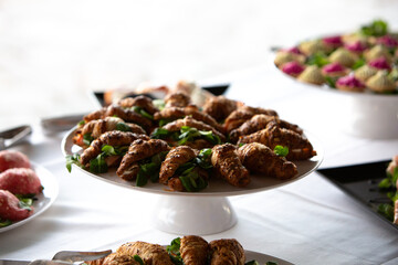 Delicious wholegrain croissants filled with salad filling a catering buffet table