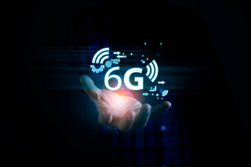 6G Technology networks Internet connecting wireless devices around the world. 6g icon in businessman hand. 6G technology is essential to businesses in the digital world..
