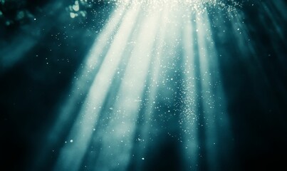 Sunlight rays through dark blue water.