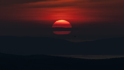 Hazy sunset over the Croatian Adriatic islands Krk and Cres.