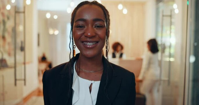 Face, woman and smile as hostess with receptionist or concierge for booking, enquiry or reservation. Female person, happy and portrait in hospitality industry or accommodation in hotel lobby as staff